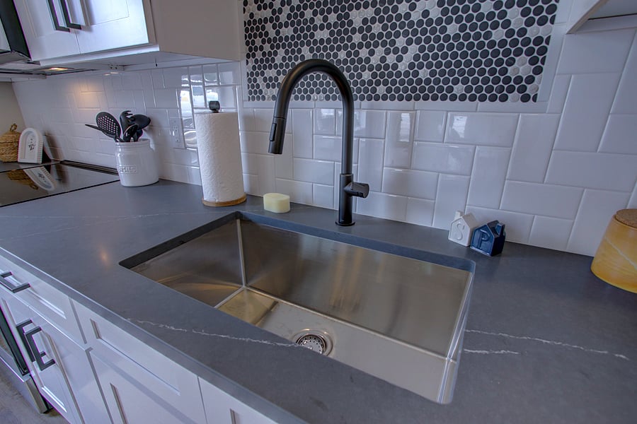 High end finishes. Soapstone quartz countertops and custom tile backsplash