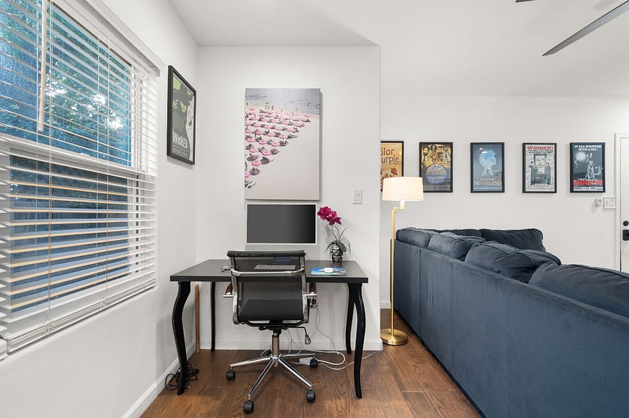 Desk and office chair in the living room is perfect for your laptop