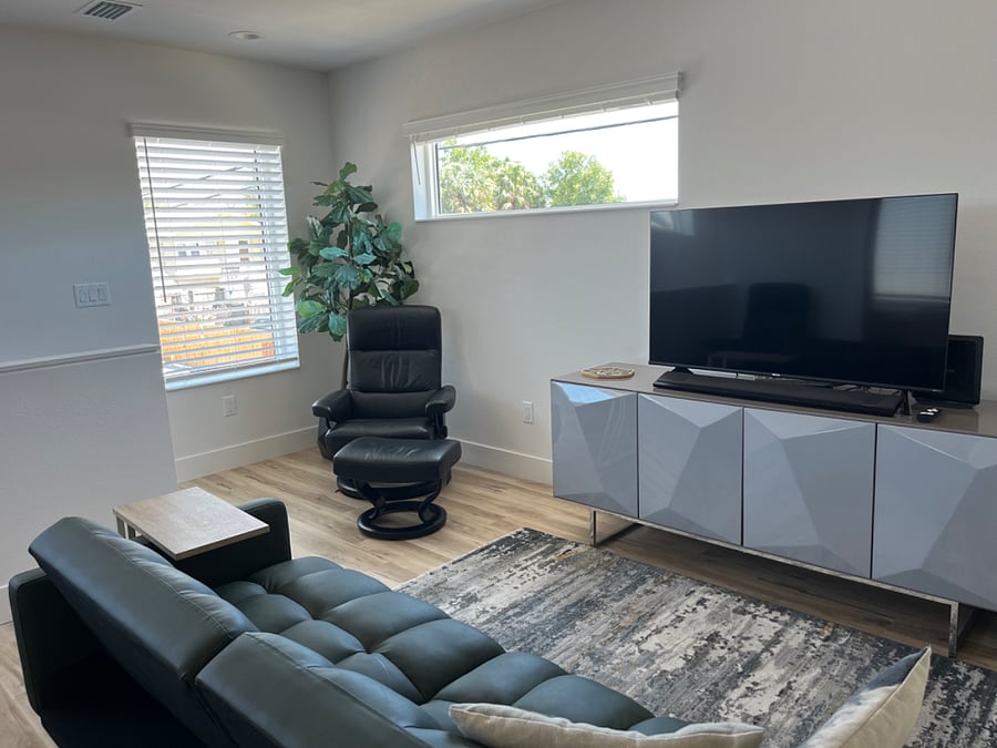 Media console with tons of storage space. Brand new Smart TV with all the viewing apps you can log into.