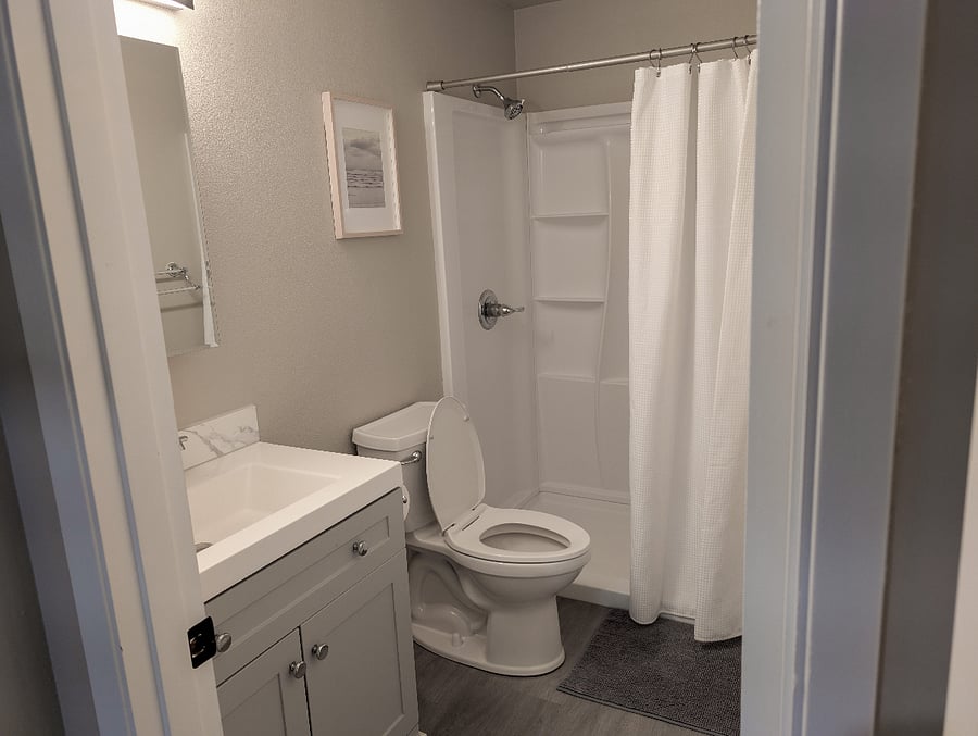 Newly remodeled bathroom centrally located with hall access and near both bedrooms