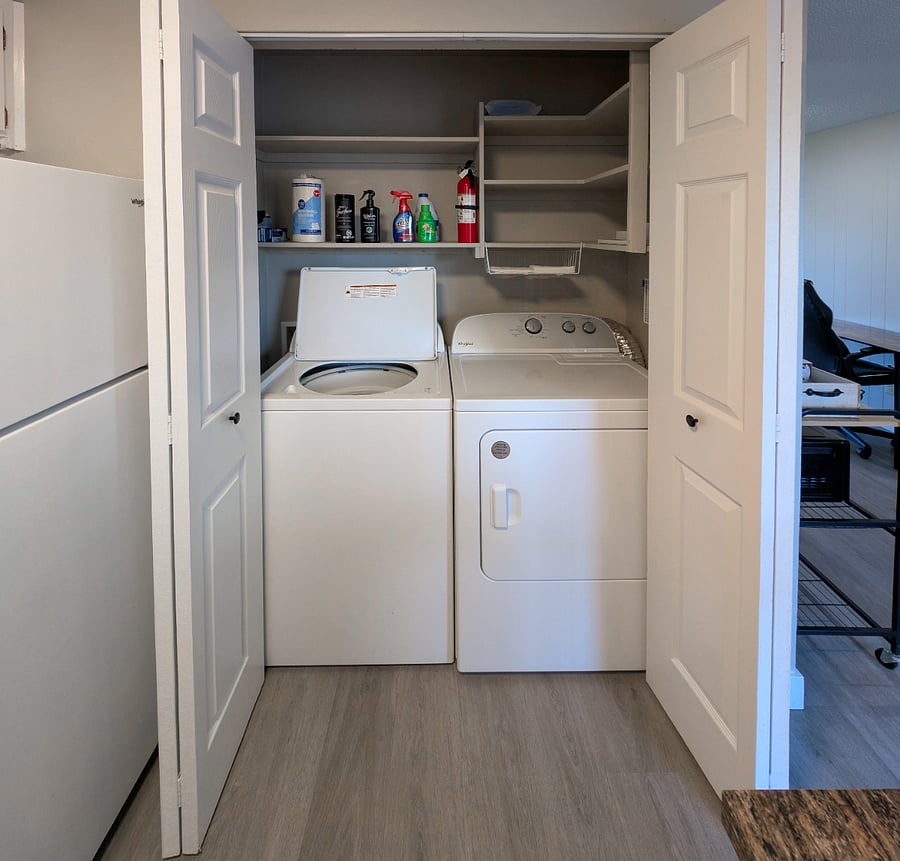 Full size washer and dryer in closet in kitchen in unit