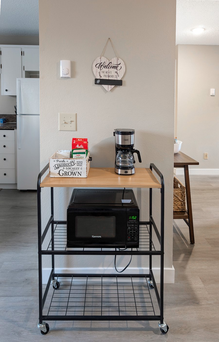 Coffee and microwave cart adjacent to kitchen