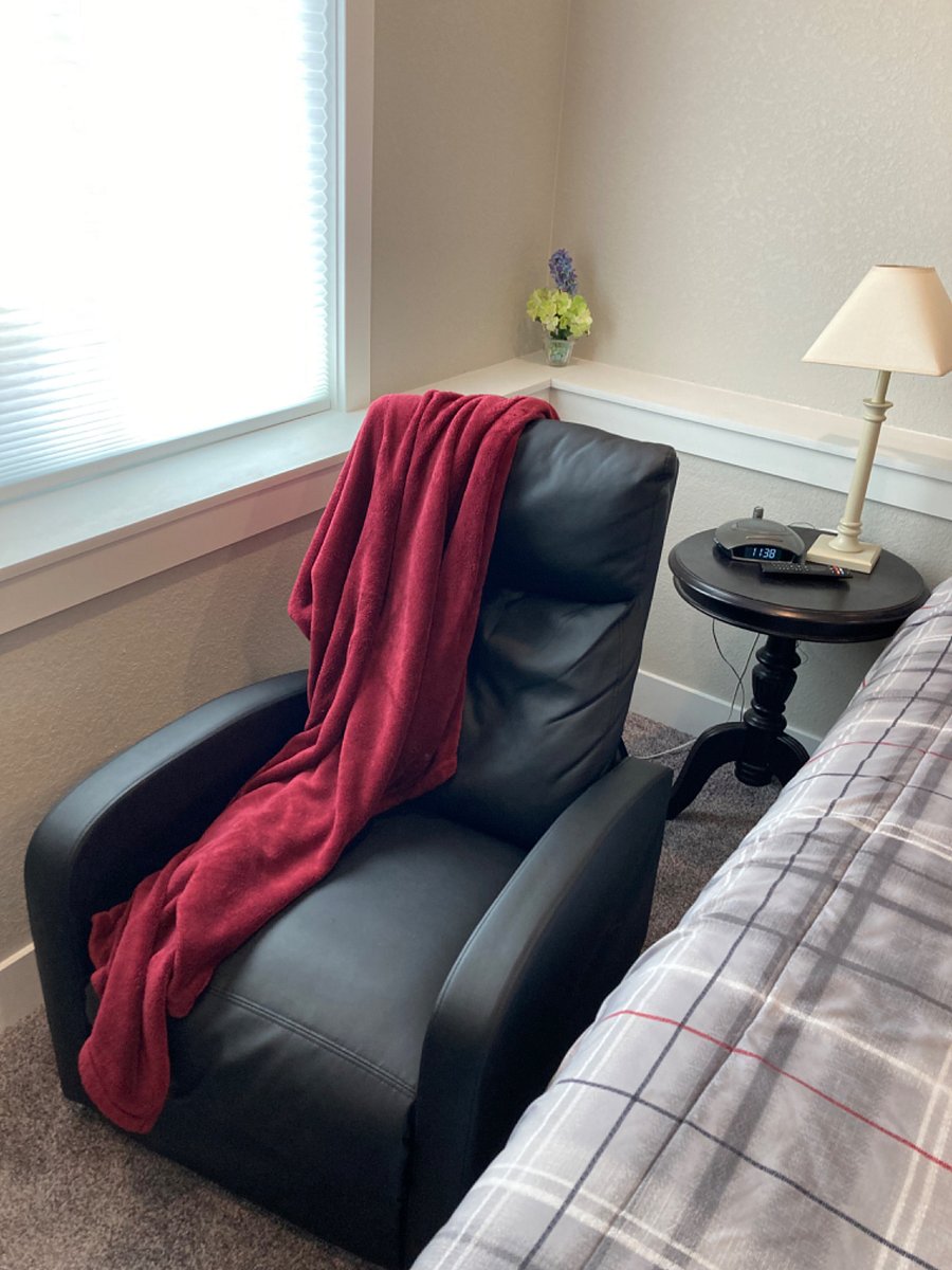 Lounge chair to cuddle up and watch a movie.