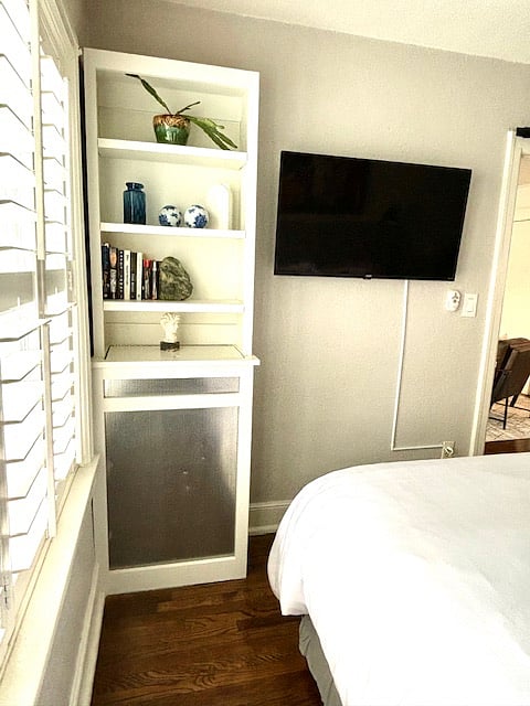 Plantation shutters to let in or block sunlight.  New smart TV.