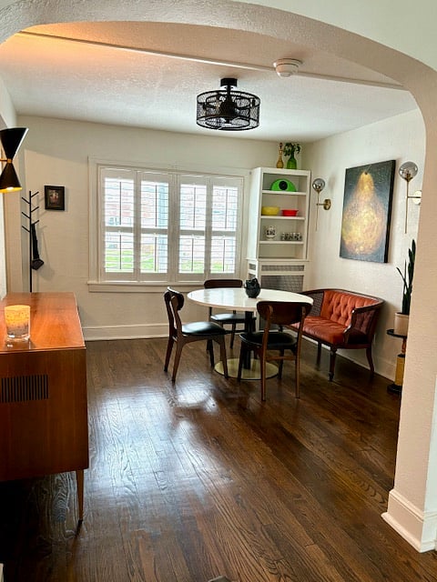 Dining room with mid-century tables & chairs.