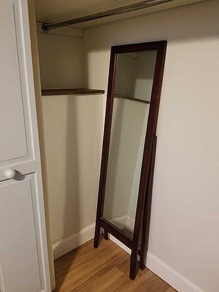 Standing mirror, but can always come out if you don't want to use it.