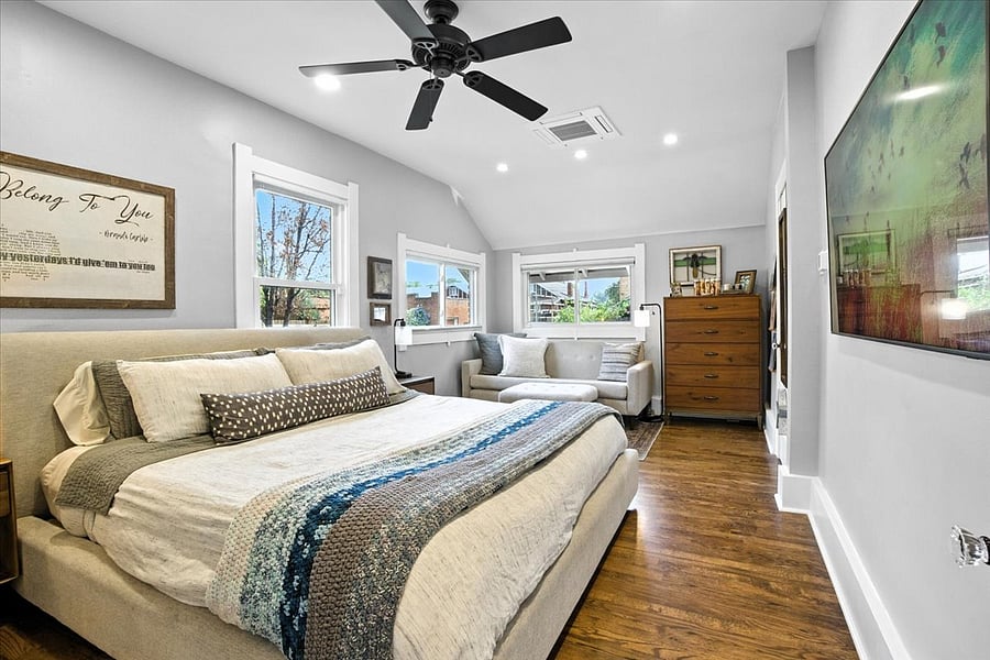 Bedroom 1: King bed, sofa, dresser, Frame Smart TV, large closet