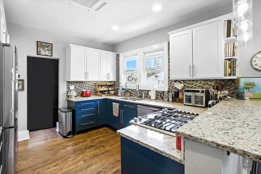 Fully-stocked kitchen complete with large sink/disposal, dishwasher, gas stove/oven, full refrigerator, microwave, coffee set up