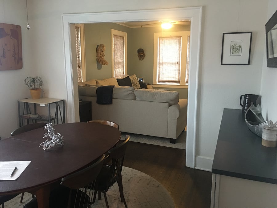 Living space has large TV which can be swiveled from mount to be seen in Kitchen/ Dining area.