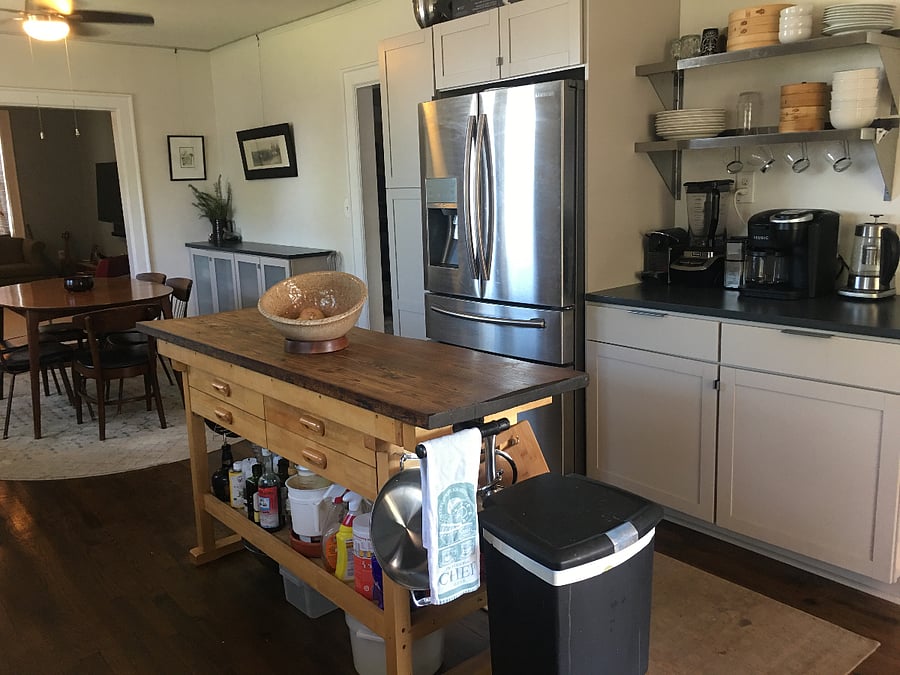 Large windows in Dining room have top/down bottom/up shades.