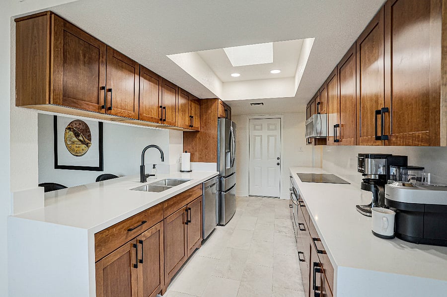 Kitchen with Quartz Countertops and full height backsplash, waterfall edges, stainless appliances, fully stocked with all dishes and cookware and appliances