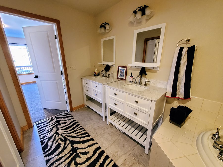 Master bath with spa tub, second closet