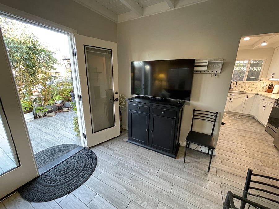 Front Room with French Doors, Ceiling Fans and Smart TV