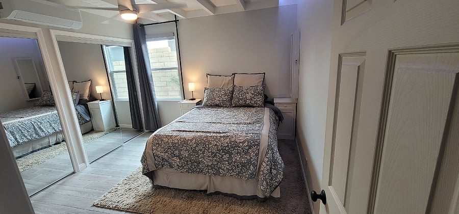 Bedroom with Queen Bed and Full length mirrored closets, Blackout Blinds