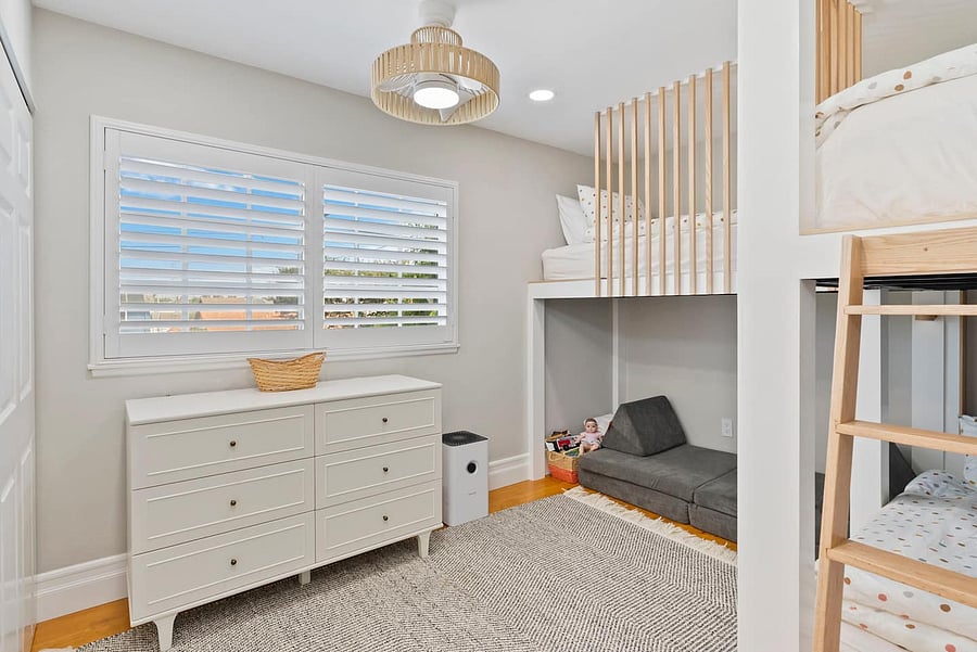 A fun and flexible sleeping space featuring bunk beds, a cozy futon, and plenty of storage for families and groups.