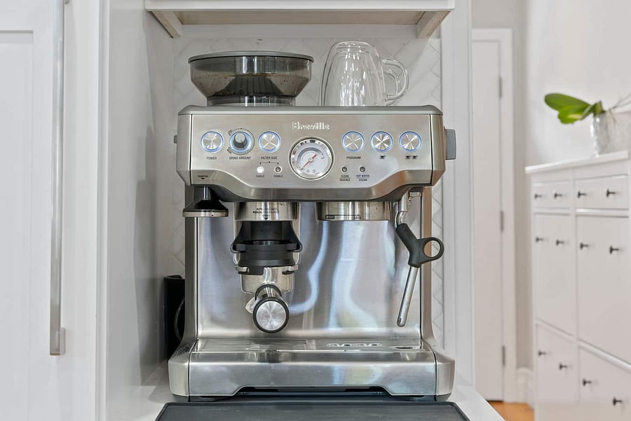 Make your favorite coffee with the Breville espresso machine, built-in grinder, and milk-frothing wand.