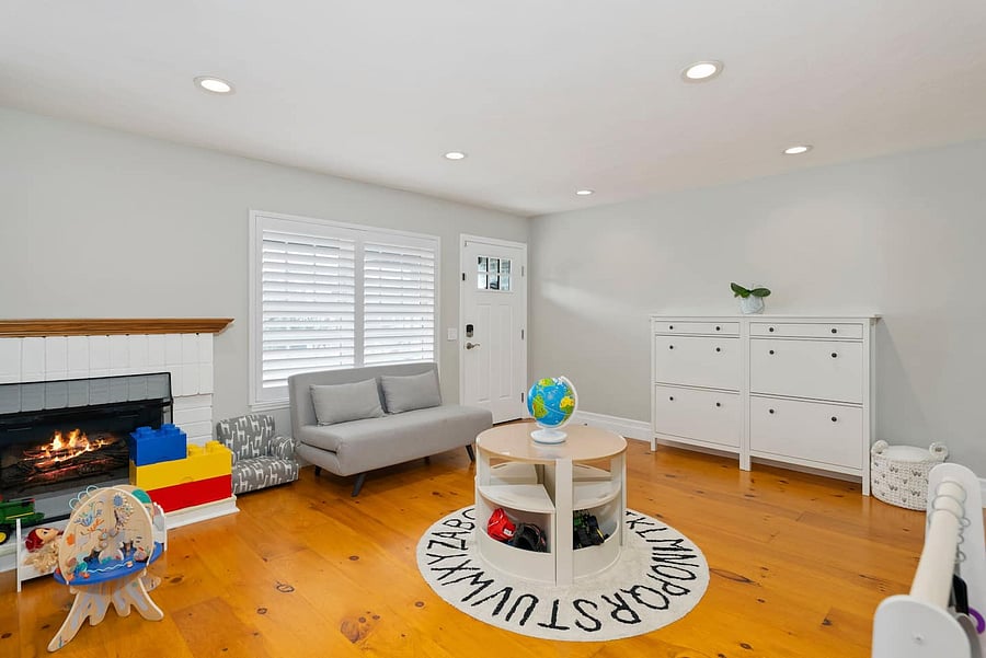 Kids can enjoy a dedicated play space with books, cozy seating, a play kitchen, and plenty of toys.