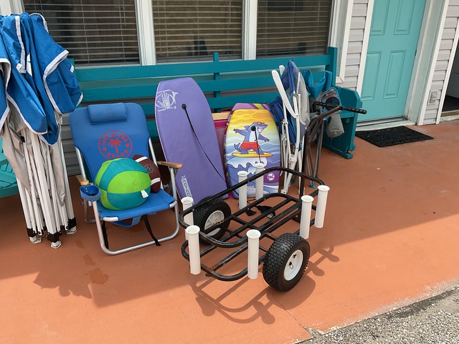Beach cart with chairs and boogie boards