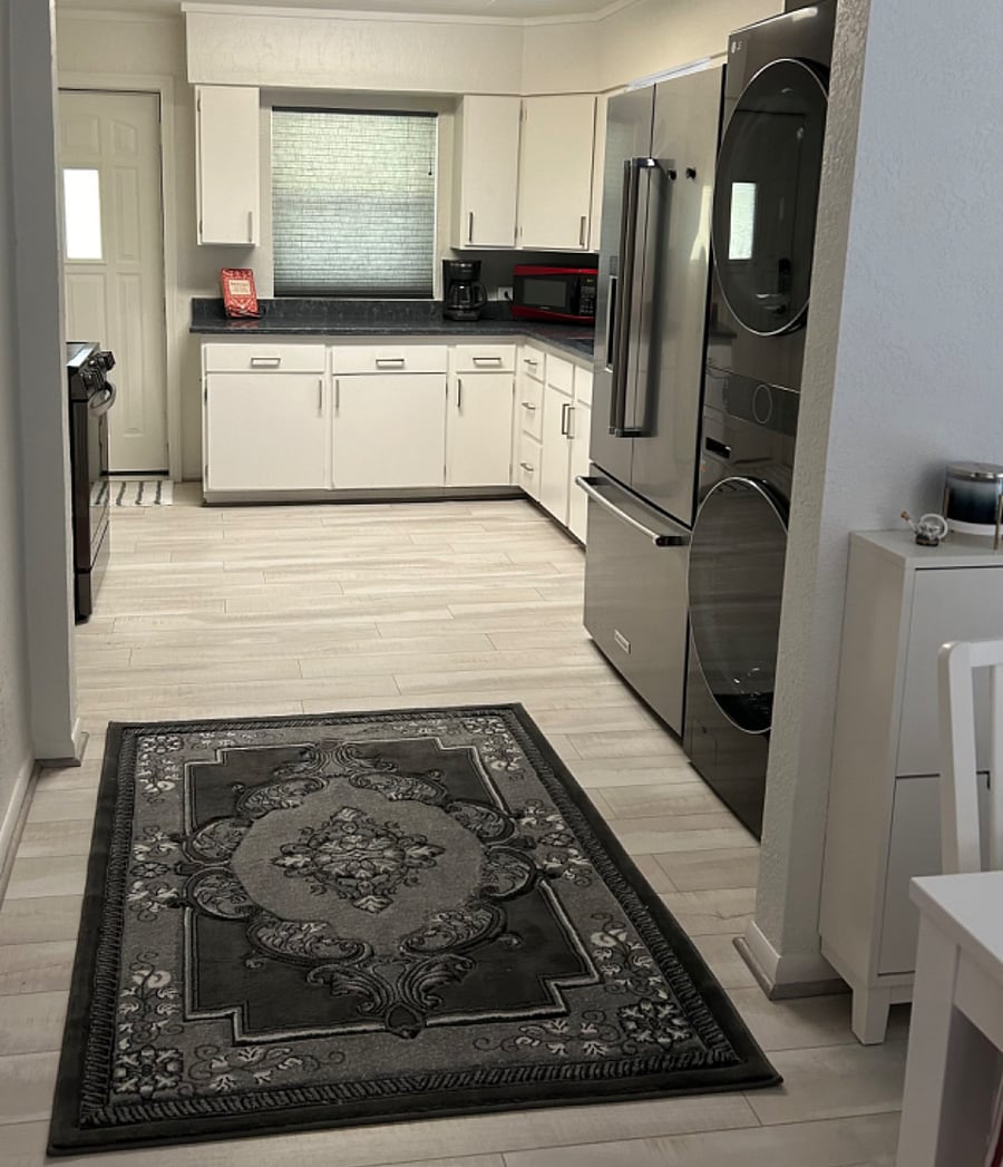 Kitchen. Original cabinets have been painted with new hardware