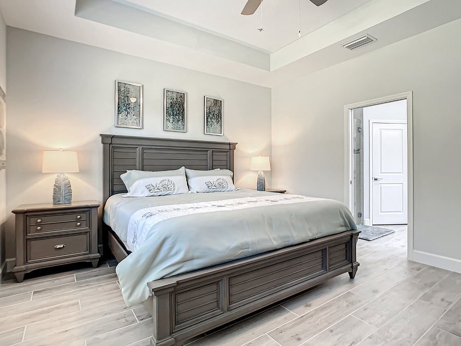 View of Owner's Suite entrance to bathroom with pocket door.