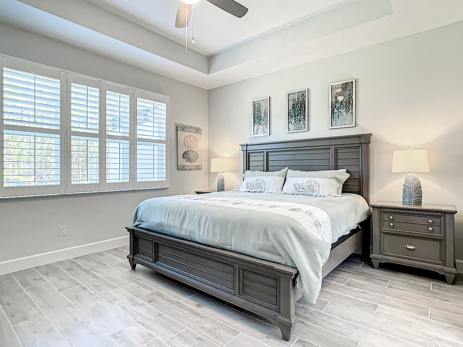 Owner's suite with king-size bed and matching headboard & night stands.
