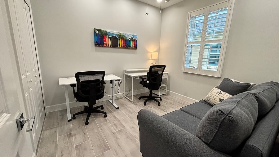 3rd bedroom has been set-up as an office with two workstations. Sofa has a hide-a-bed. HP Officejet Pro printer is hidden in the closet.
