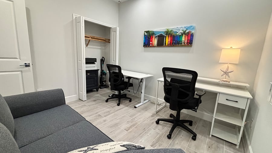 3rd bedroom has been set-up as an office with two workstations. Sofa has a hide-a-bed. HP Officejet Pro printer is hidden in the closet.