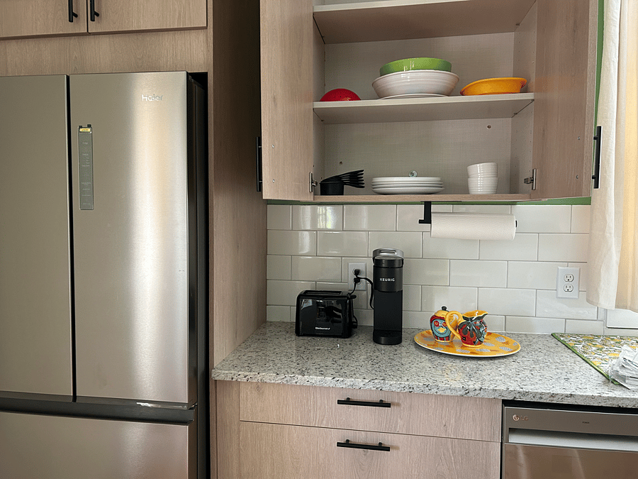 Contemporary cabinets stocked with everything you need for cooking and dining