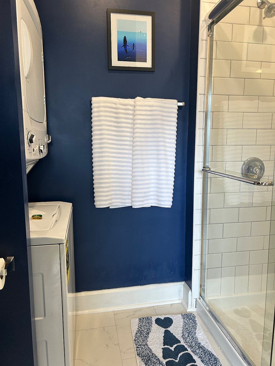 New stacking washer and dryer in bathroom