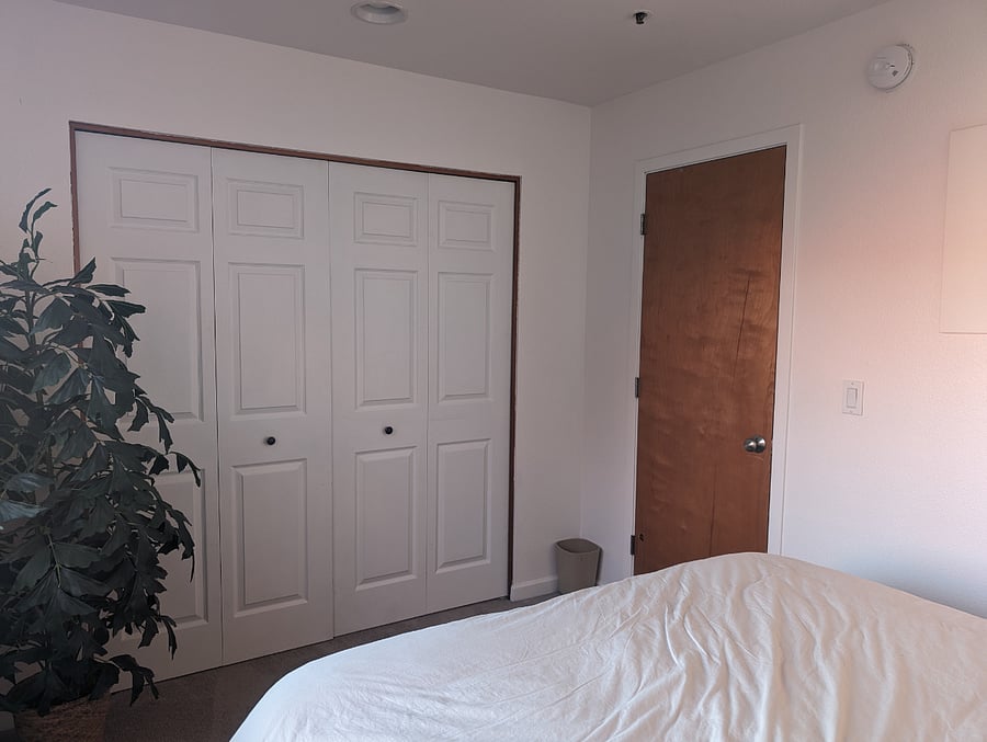 Smaller bedroom with a queen bed