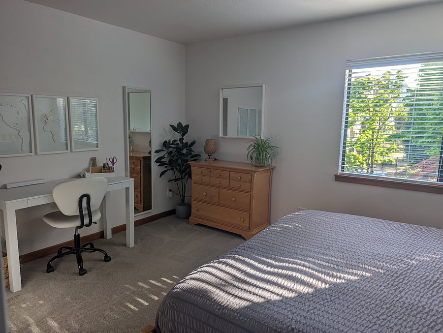 Large bedroom with a king bed and working desk