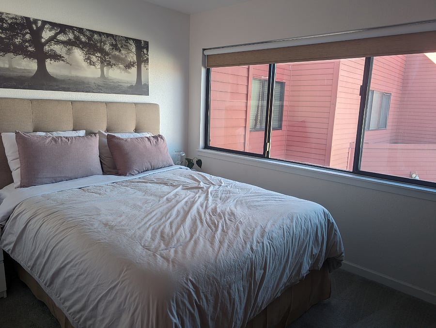 Smaller bedroom with a queen bed