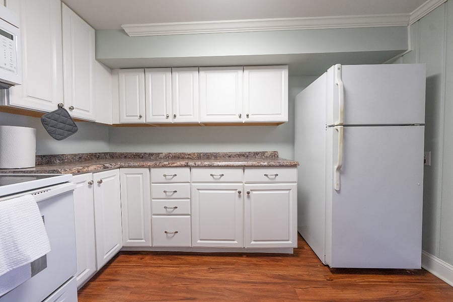 Kitchen includes full-size refrigerator/freezer and plenty of cabinet space