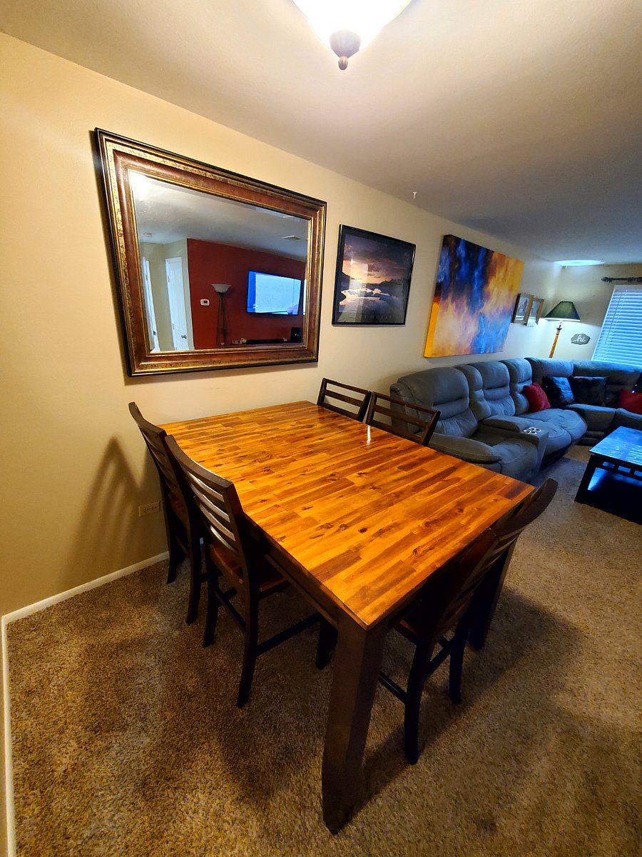 Large Wood dinner table can fit up to 6 guests.
