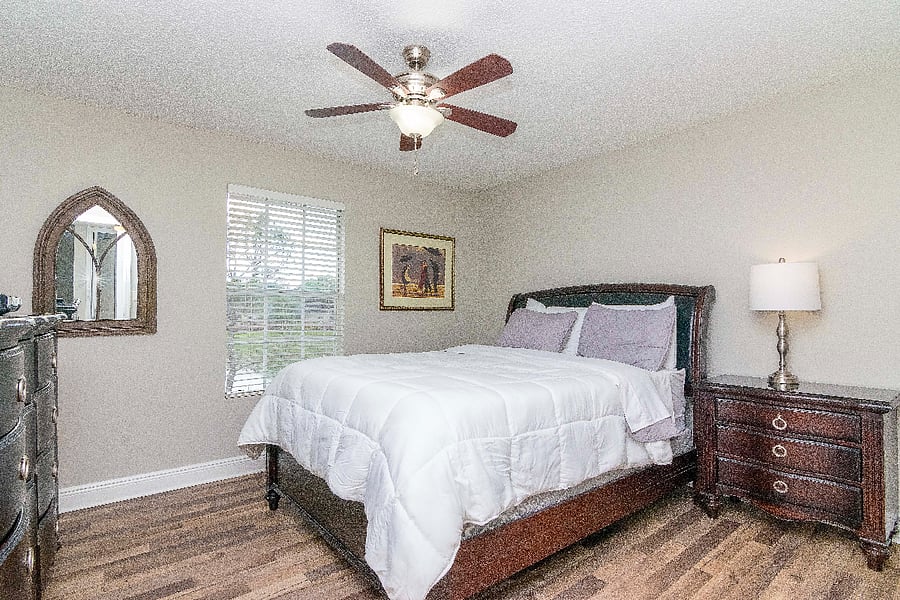 Bedroom w/ Queen Bed, Smart TV, and Walk-In Closet