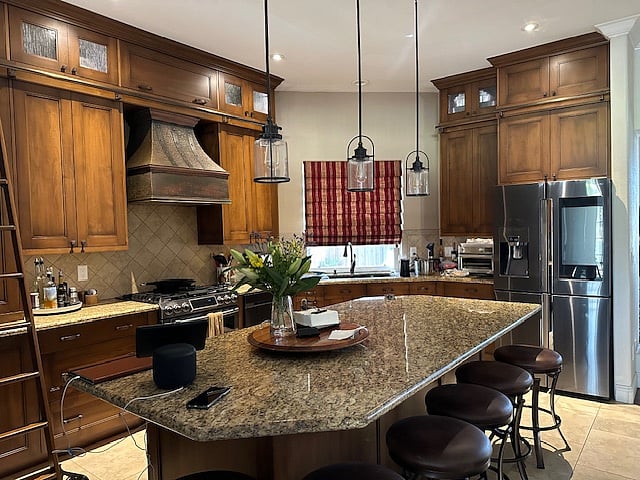 The kitchen is fully customized and the island seats six