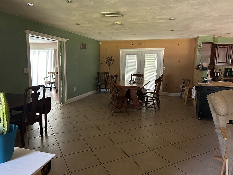 Shared dinning room area also showing entrance to your personal living room space.  Sliding doors separate your living area from shared area.  