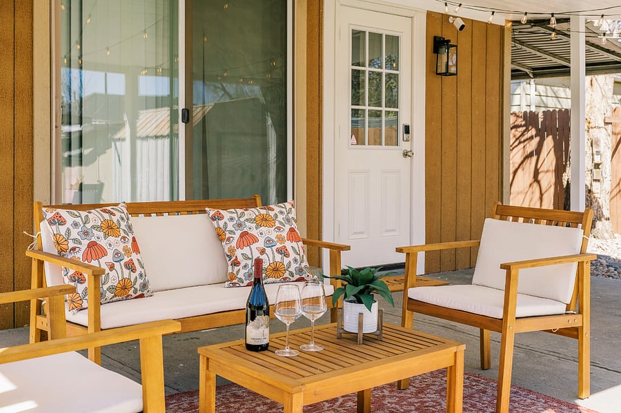 Covered patio with outdoor seating for up to 4 people