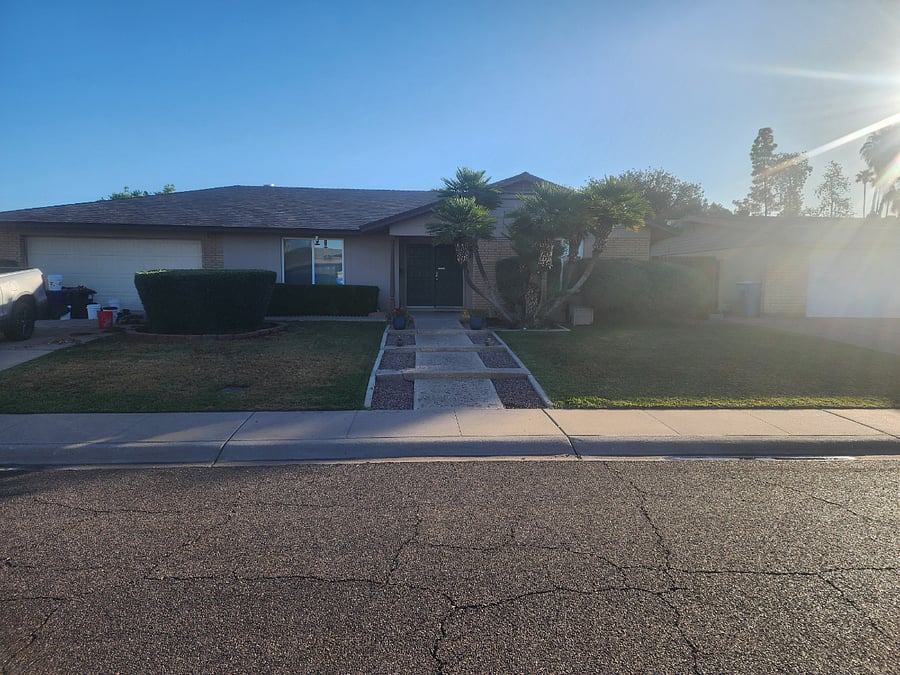 Front of house showing walk up from street. The green door is the main entertainment to the home. 