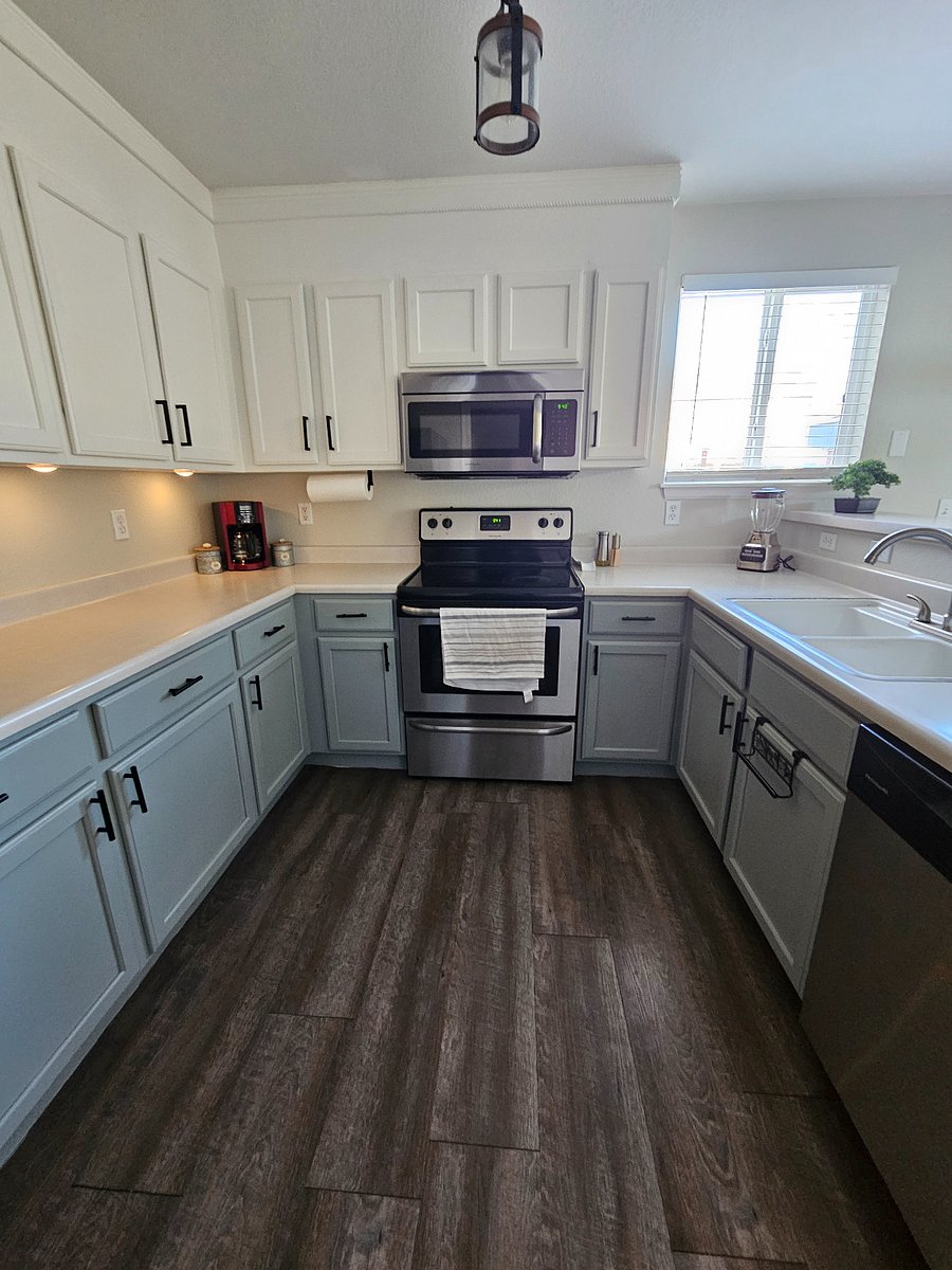 Full kitchen with stovetop, oven, microwave, full size Samsung fridge, coffee maker, blender, toaster and dishwasher.