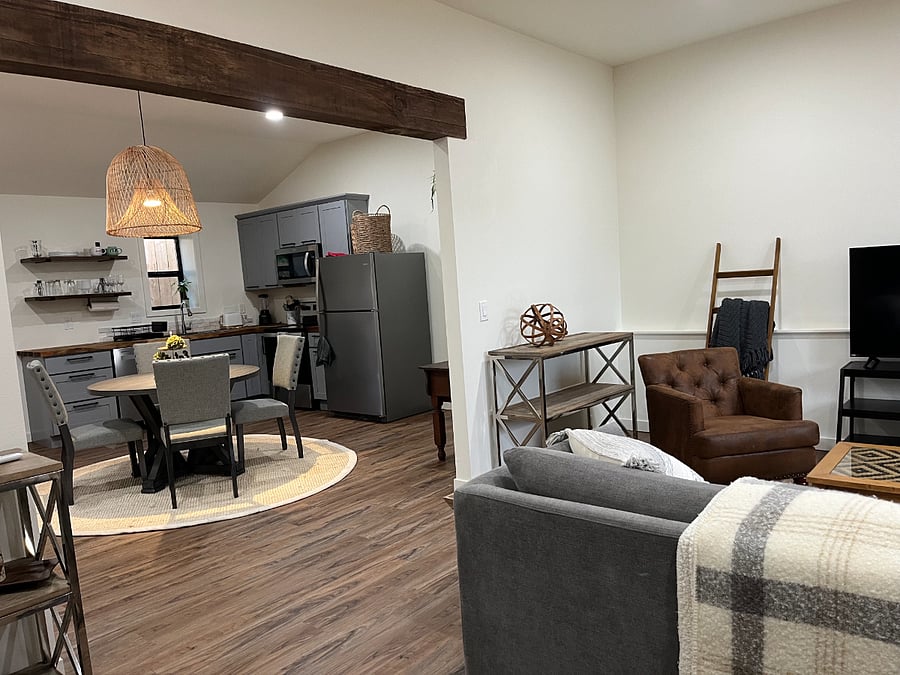 Look from bedroom thru living room to kitchen
