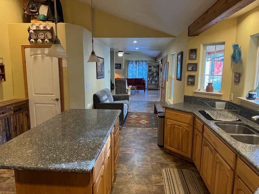 Kitchen Island with view of entry and living room