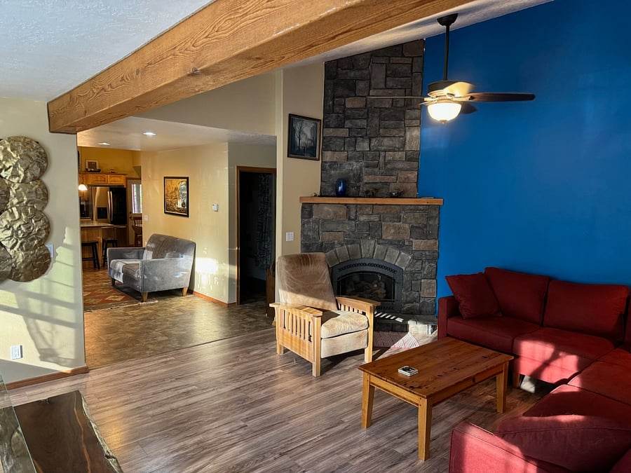 Living room with view of entry. Gas Fireplace