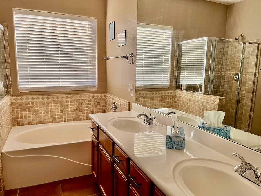 Primary bathroom with soaker tub, walk in shower, double sinks and walk in closet