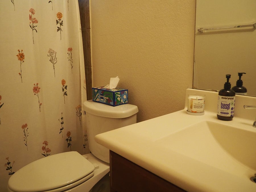 Full sized bathroom with shower, tub, and full sized closet.