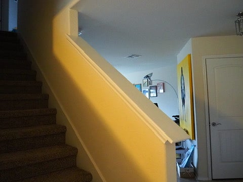 Main floor stairs leading up to the bedrooms and full bathrooms.