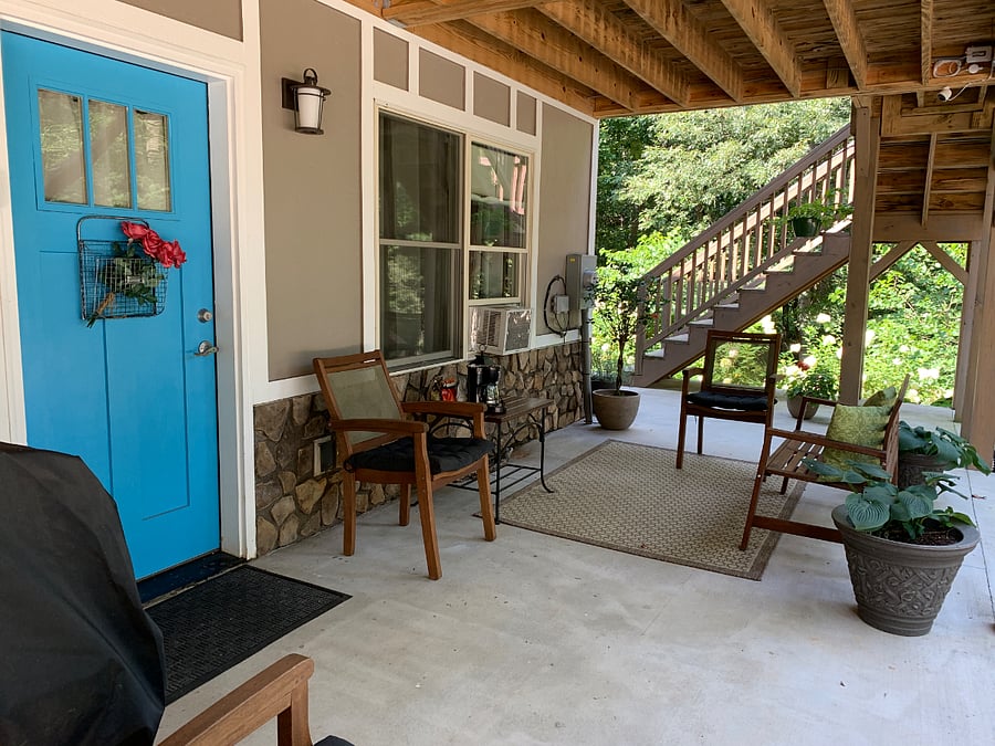 Shaded seating area outside entrance.