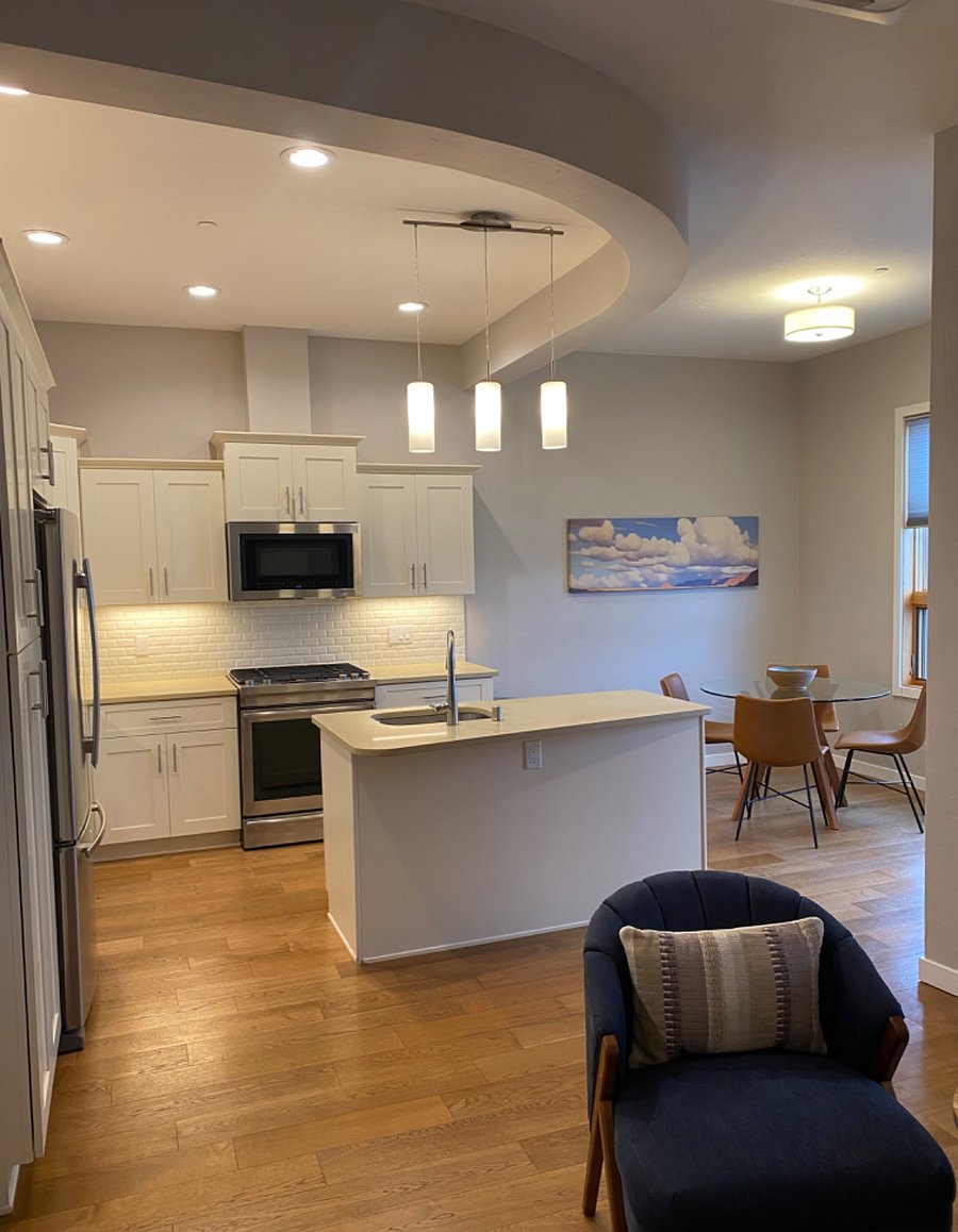 View from living into kitchen and dining areas