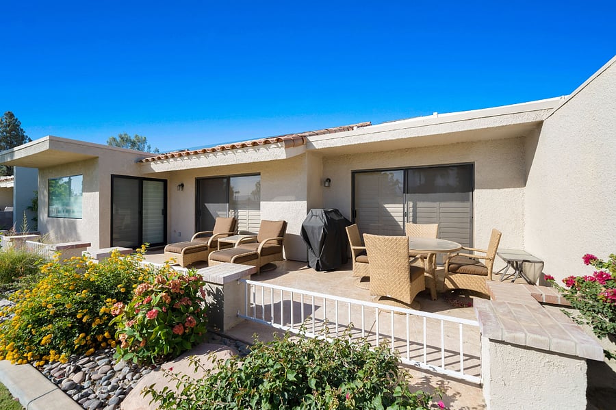 Back patio with plush furniture and private BBQ