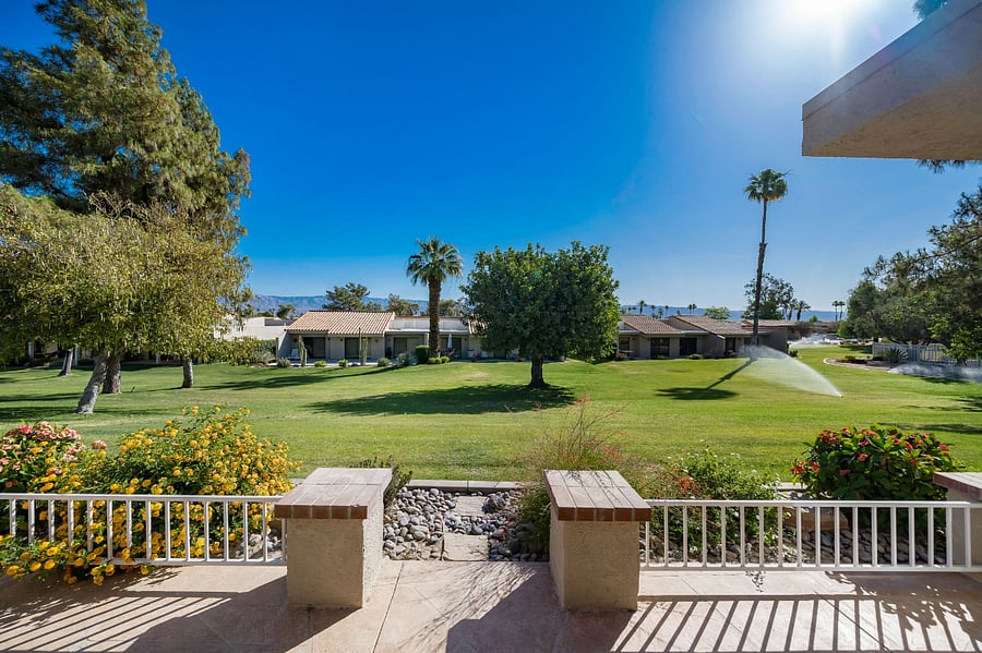 Patio overlooks expansive green belt area and is close to the pool/spa